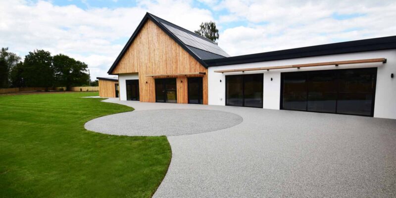 Modern bespoke disability adapted bungalow. A sustainably-designed accessible house with wood cladding and solar panels